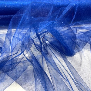 May include: Royal blue tulle fabric with silver glitter. The fabric is sheer and has a delicate texture.