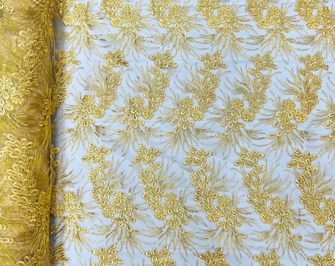 Gold feather design lace with metallic cord and embroider with sequins on a mesh-Sold by the yard.