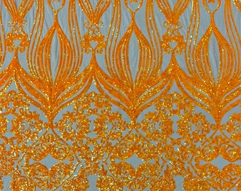 Neón Orange iridescent sequin damask design on a Nude 4 way stretch mesh-sold by the yard.