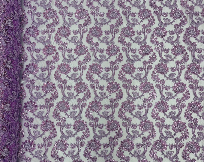 Lilac corded flowers embroider with sequins on a mesh lace fabric-prom-sold by the yard.