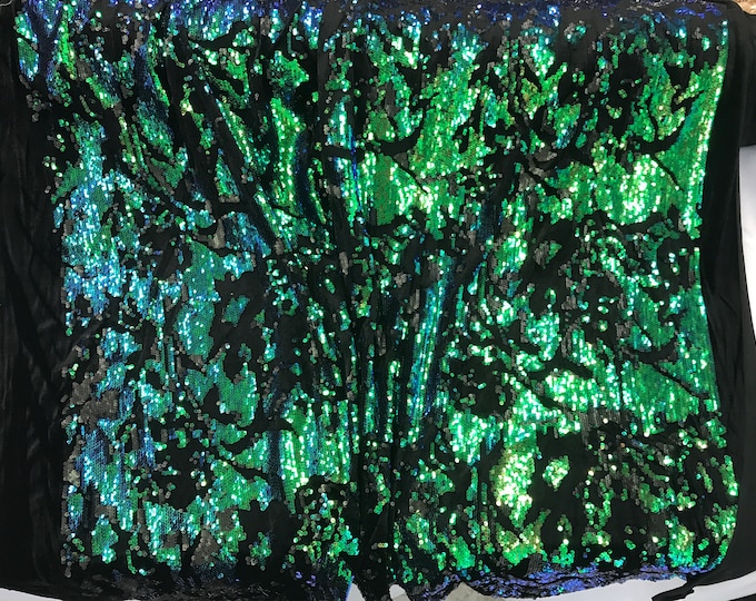 Green iridescent sequins embroider on a black 2 way stretch velvet-apparel-fashion-decorations-dresses-nightgown-sold by the yard.