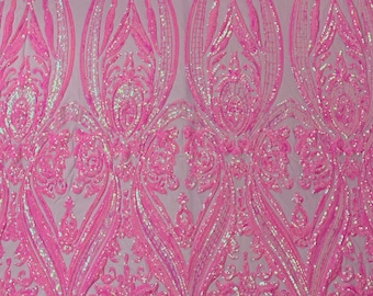 Candy pink iridescent empire design embroider with glossy sequins on a 4 way stretch mesh--sold by the yard.NEW!