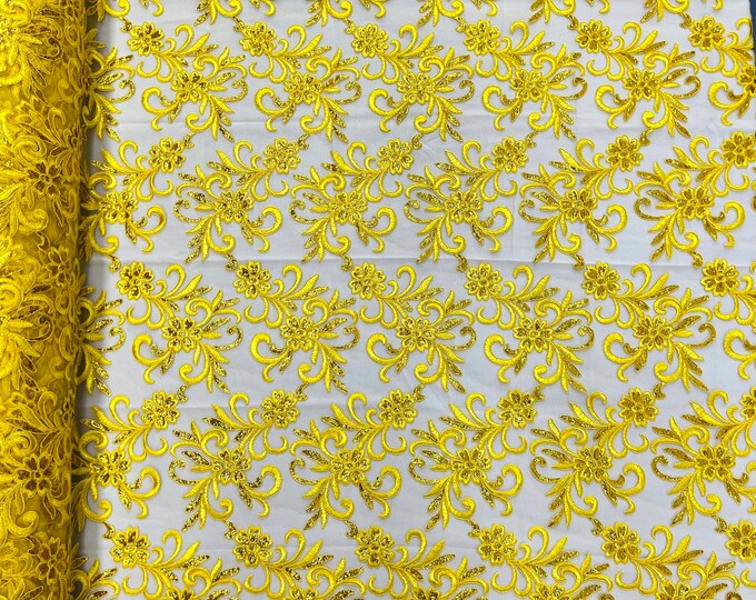 Yellow corded flowers embroider with sequins on a mesh lace fabric-sold by the yard-