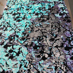 Aqua-white iridescent and reversible sequins embroidery on a 4 way stretch black velvet-dresses-fashion-sold by the yard-free shipping USA.