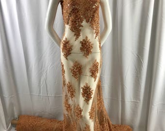 Cinnamon charming design embroider and beaded on a mesh lace-prom-nightgown-bridal-wedding-apparel-fashion-sold by the yard.