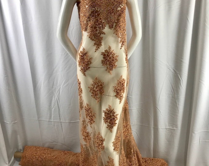 Cinnamon charming design embroider and beaded on a mesh lace-prom-nightgown-bridal-wedding-apparel-fashion-sold by the yard.