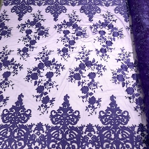 Purple flowers flat lace embroider on a 2 way stretch mesh sold by the yard.