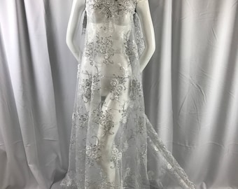 White/silver 3d flowers embroider with sequins on a white mesh lace. Wedding/bridal/prom/nightgown fabric-dresses-fashion-Sold by the yard.