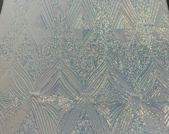 Clear Aqua Iridescent geometric diamond design with shiny sequins on a white 4 way stretch mesh fabric- sold by the yard.