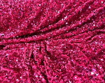 Fuchsia Shiny sequins all over a stretch velvet , sold by the yard.