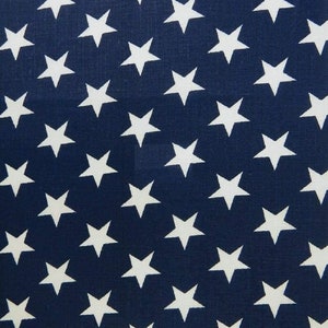 May include: A navy blue fabric with a repeating pattern of white stars.