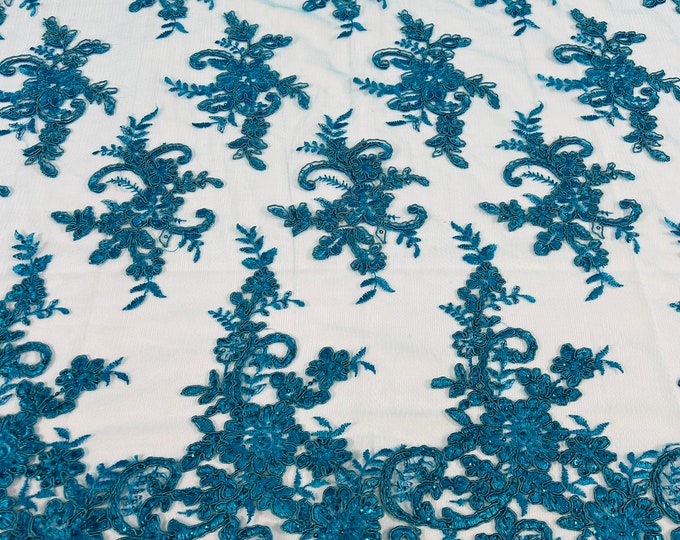 Turquoise Lex floral design corded and embroider with sequins on a mesh lace fabric-prom-sold by the yard.