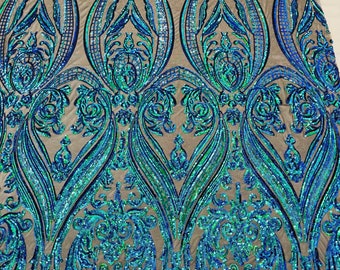 Green iridescent empire damask design with sequins embroider on a Black 4 way stretch mesh fabric-sold by the yard.