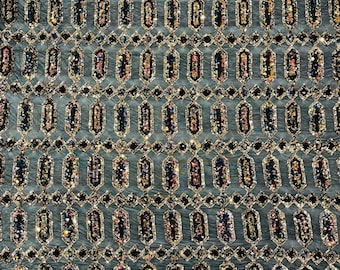 Jewel iridescent geometric sequin design on a black 4 way stretch mesh fabric-sold by the yard.