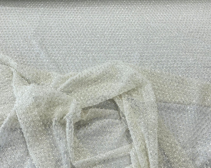 Ivory heavy beaded princess design embroider with beads and sequins on a glitter mesh lace-sold by yard.