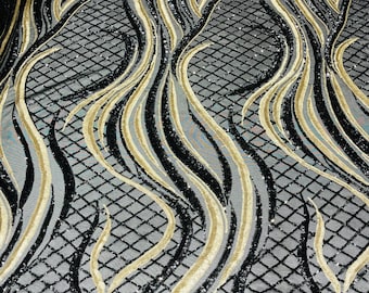 Black/Matte Gold sequin flame design on a 4 way stretch black mesh-sold by the yard.