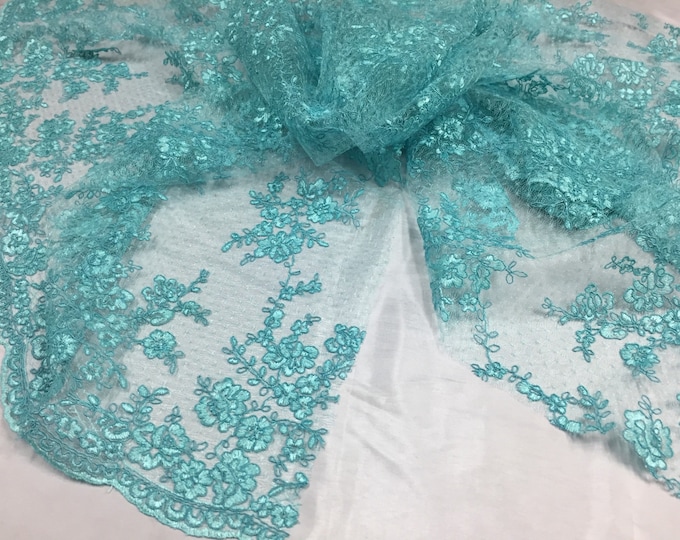 Sensational aqua flowers Embroider And Corded On a mesh lace-prom-nightgown-dresses-decorations-sold by the yard.