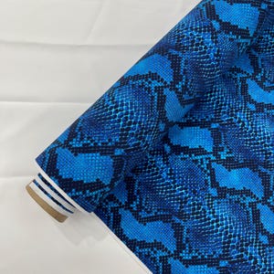 Royal Blue/Black python snake print on a 4 way stretch nylon spandex/58” wide/sold by the yard.