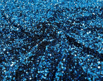 Turquoise 5mm sequins on a stretch black velvet 2-way stretch, sold by the yard.