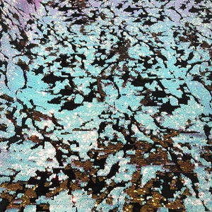 Aqua/ Pink/Gold iridescent sequins flip two tone camouflage  design on a black stretch velvet, Sold by the yard.