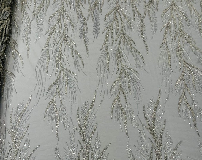 Silver Fiesta Design Embroider and heavy beading on a mesh lace-sold by the yard.