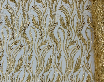 Gold Festival Design Embroider and heavy beading on a mesh lace-sold by the yard.