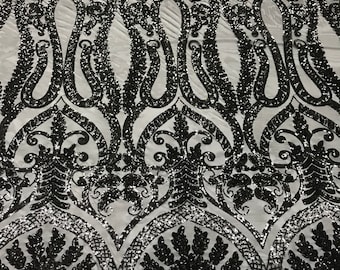 Black diva design embroider with shiny sequins on a 4 way Stretch power mesh-dresses-fashion-apparel-prom-nightgown-sold by the yard.