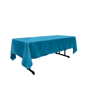 May include: A teal tablecloth draped over a table. The tablecloth is made of a smooth, wrinkle-resistant fabric.