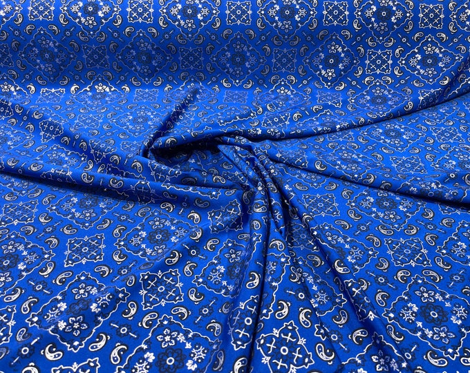 Royal blue metallic bandanna print on a stretch tricot spandex fabric- Sold by the yard.