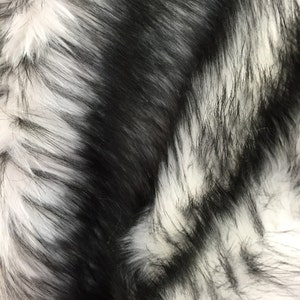 White/black husky faux fur, 2 tone shaggy faux fur. Sold by the yard.60" wide.