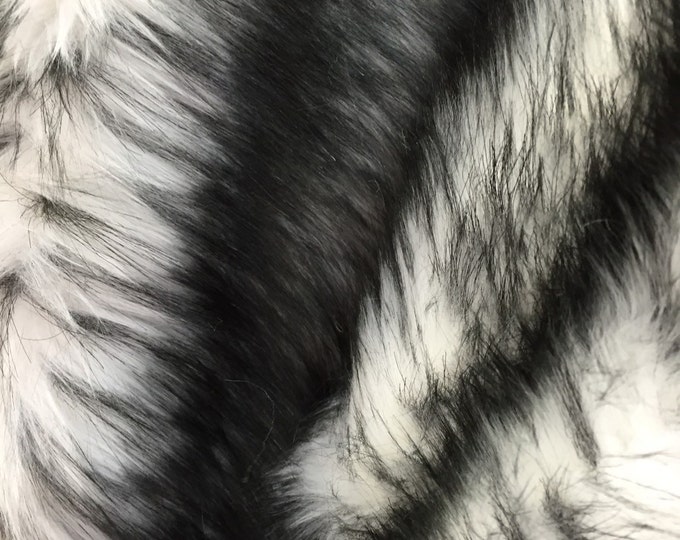 White/black husky faux fur, 2 tone shaggy faux fur. Sold by the yard.60" wide.