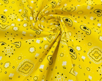 Könnte beinhalten: Gelber Stoff mit einem weißen und schwarzen Paisley-Muster.
