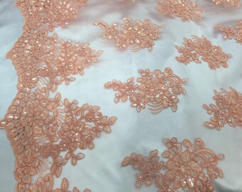 Peach flower lace corded and embroider with sequins on a mesh.wedding/bridal/prom/nightgown fabric. Sold by the yard.