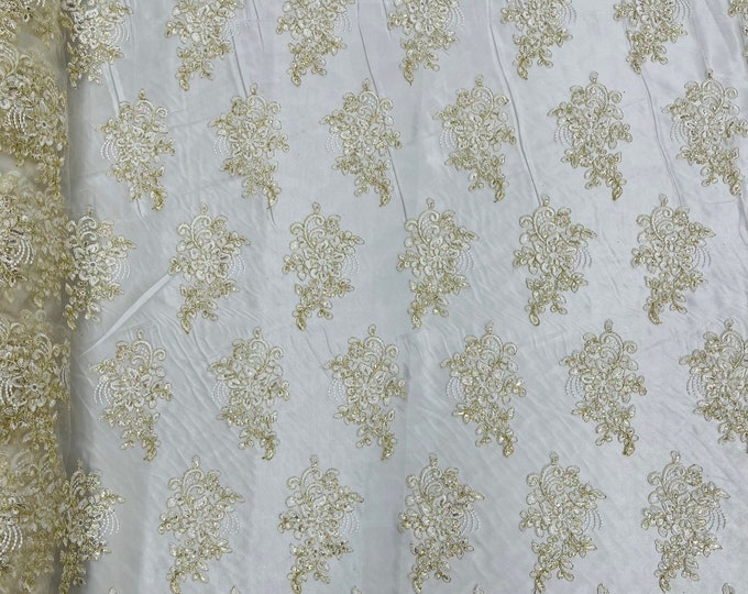 Ivory gold corded embroider flowers with sequins on a mesh lace fabric-prom-sold by the yard.