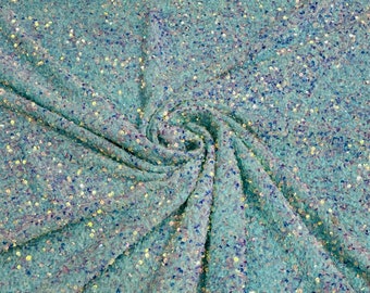 Clear iridescent 5mm sequins on a mint green stretch velvet 2-way stretch, sold by the yard.