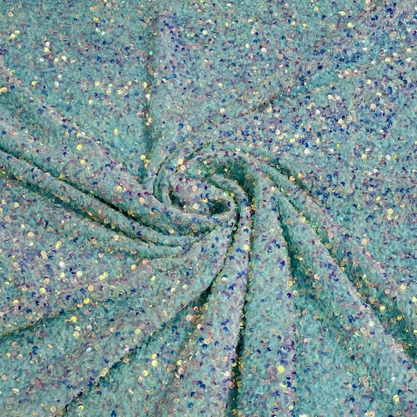 Clear iridescent 5mm sequins on a mint green stretch velvet 2-way stretch, sold by the yard.