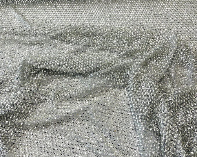 Silver heavy beaded princess design embroider with beads and sequins on a glitter mesh lace-sold by yard.