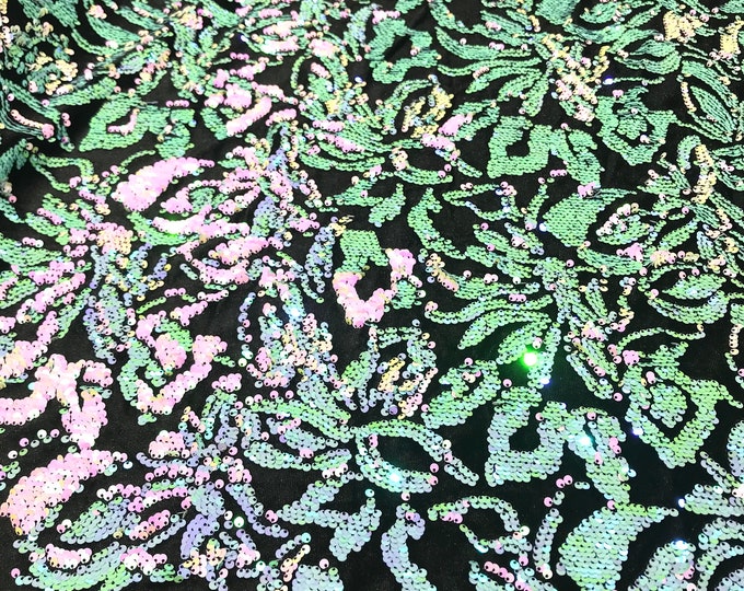 Mint, Pink iridescent sequins flip two tone floral design on a black stretch velvet, Sold by the yard.