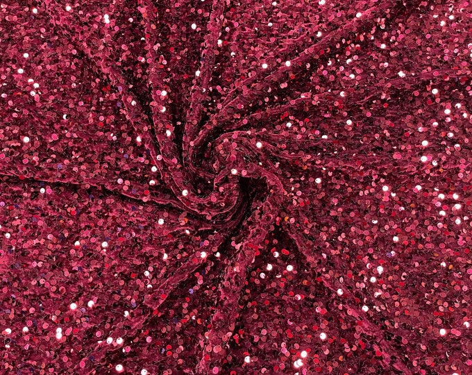 Burgundy economic all over shiny sequins on a 2 way stretch velvet , sold by the yard.