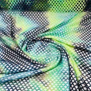 Green/Navy Blue big fishnet diamond mesh tie dye with silver glitter 4 way stretch 58/60 inches wide. Sold by the yard.