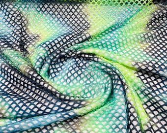 Green/Navy Blue big fishnet diamond mesh tie dye with silver glitter 4 way stretch 58/60 inches wide. Sold by the yard.