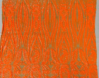 Orange hologram Paisley sequin design on a nude 4 way stretch mesh-prom-sold by the yard.