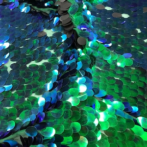 Green hologram iridescent mermaid fish scales on a green mesh-prom-decorations-dresses-sequins-nightgown-craft-sold by the yard.