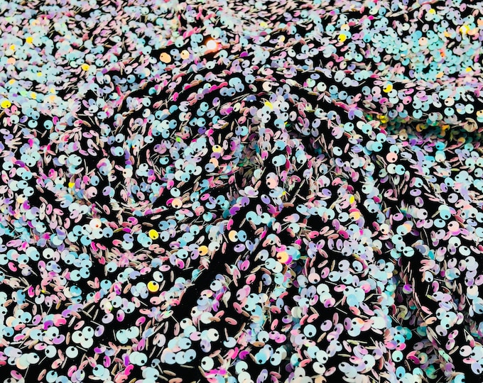 Aqua/pink iridescent 5mm sequins on a black stretch velvet 2-way stretch, sold by the yard.