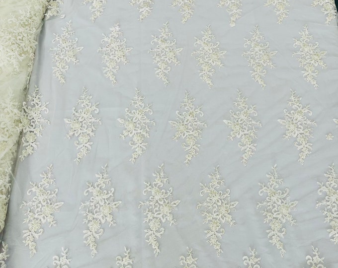 Ivory flower damask embroider with sequins and heavy beaded on a mesh lace fabric-sold by the yard.