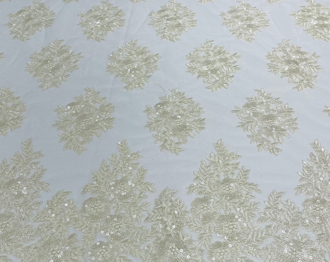Cream Floral corded embroider with sequins on a mesh lace fabric-sold by the yard.