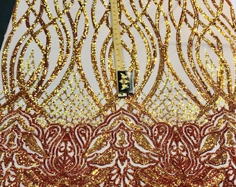 Orange iridescent phoenix flames sequin design on a 4 way stretch nude mesh-prom-nightgown-sold by the yard-free shipping in the USA-