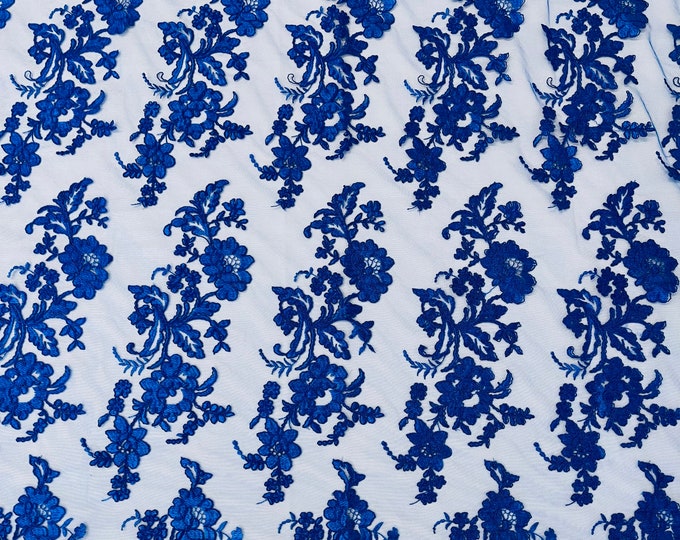 Royal blue floral design embroider and corded on a mesh lace fabric-sold by the yard.