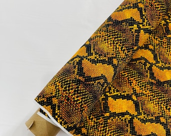 Gold/Black python snake print on a 4 way stretch nylon spandex/58” wide/sold by the yard.