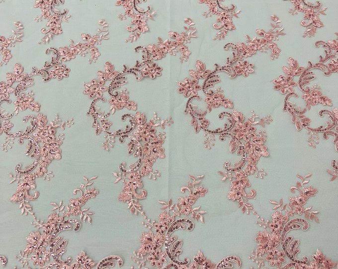 Pink flower lace corded and embroider with sequins on a mesh-Sold by the yard.